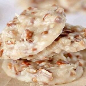 Golden pecan coconut praline cookies cooling on wax paper