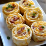 Bacon Cheddar Ranch Pinwheels sliced and served on a platter