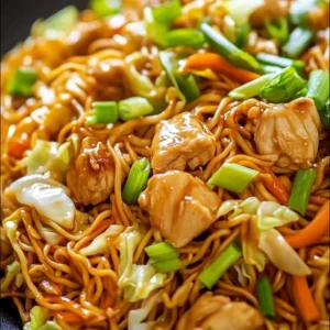 A plate of Chicken Chow Mein with tender noodles and a rich, savory sauce.