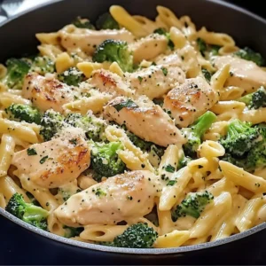 A plate of Creamy Chicken and Broccoli Pasta garnished with Parmesan