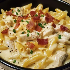 A bowl of Creamy Chicken Bacon Ranch Delight with melted cheese and crispy bacon on top
