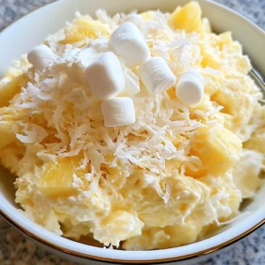 Hawaiian Pineapple Coconut Fluff served in a bowl with extra coconut topping