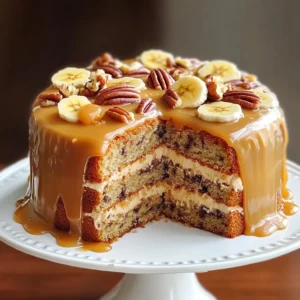 A slice of Caramel Banana Pecan Cake drizzled with caramel sauce and garnished with pecans and banana slices.