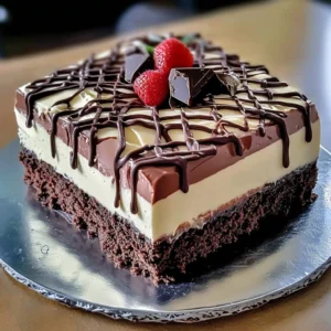 A slice of Chocolate Trifecta Mousse Serenade with chocolate ganache drizzle