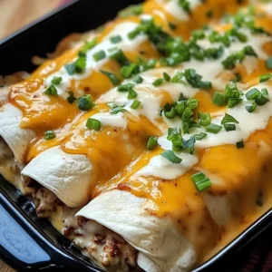 A plate of cheesy Jalapeño Popper Chicken Enchiladas, smothered in creamy sauce and garnished with green onions.