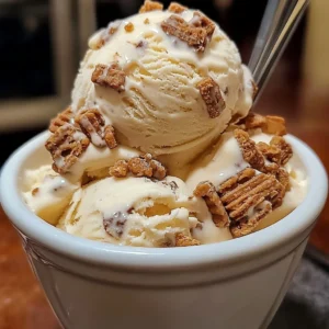 A bowl of Malted Milk Toffee Crunch Ice Cream with toffee bits on top