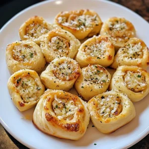 A plate of Parmesan Garlic Pizza Rolls served with marinara dipping sauce