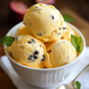 A bowl of Passion Fruit Ice Cream topped with fresh passion fruit pulp