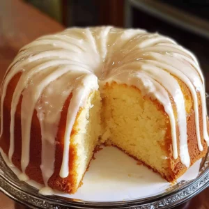 slice of Vanilla Buttermilk Pound Cake drizzled with cream cheese glaze