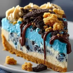 Fun Cookie Monster Cheesecake topped with crushed cookies and whipped cream