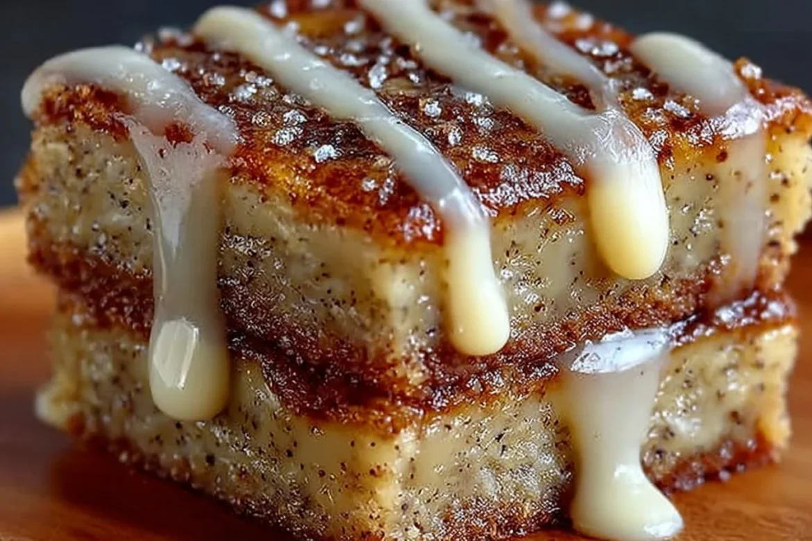 Delicious banana bread brownies with chocolate chips on a wooden table.
