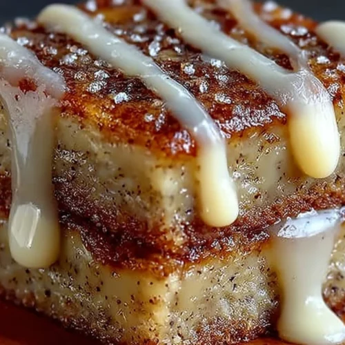 Delicious banana bread brownies with chocolate chips on a wooden table.