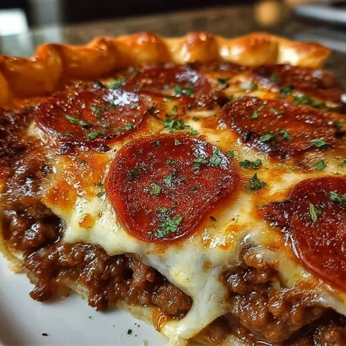 Delicious deep hamburger pie with sausage and pepperoni, ready to serve.
