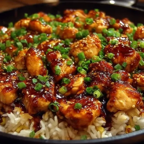 One-Skillet Honey BBQ Chicken and Rice dish plated with fresh herbs
