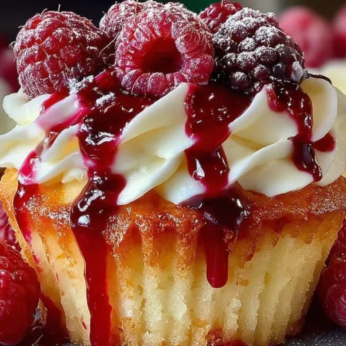 Summer Raspberry Cheesecake Cupcakes topped with fresh raspberries