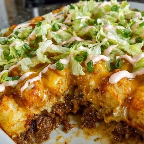 Big Mac Tater Tot Casserole topped with cheese and served in a baking dish
