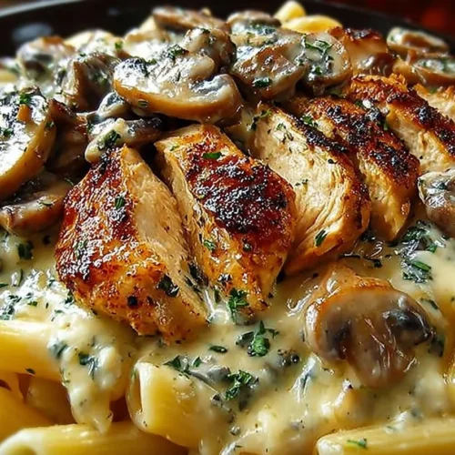 Delicious chicken and mushroom pasta with creamy sauce in a plated dish