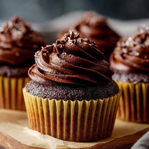 Decadent chocolate ganache cupcakes topped with smooth chocolate ganache.