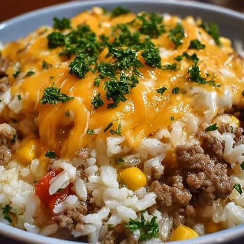 A delicious plate of cheesy beef and rice, showcasing a comforting home-cooked meal.