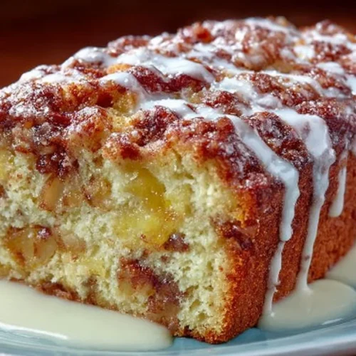 Deliciously baked Country Apple Fritter Bread with chunks of apples and cinnamon.