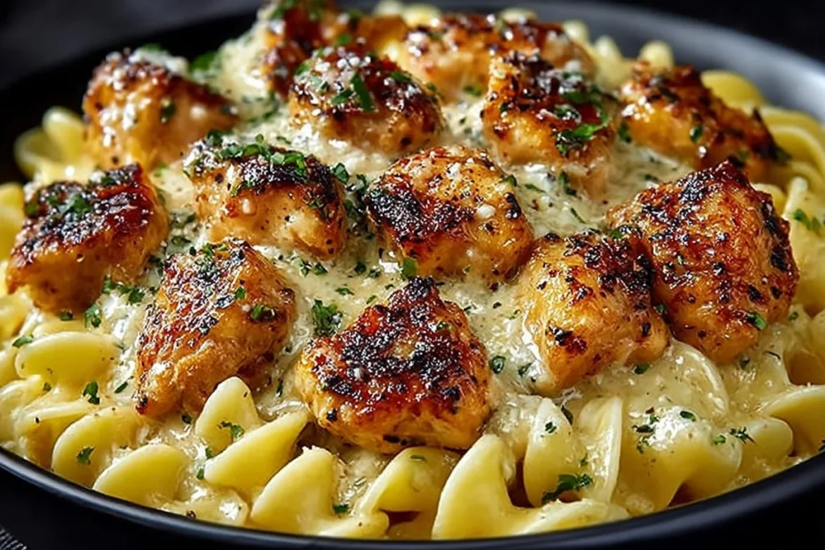 Delicious Garlic Butter Chicken Bites served with creamy Parmesan pasta.