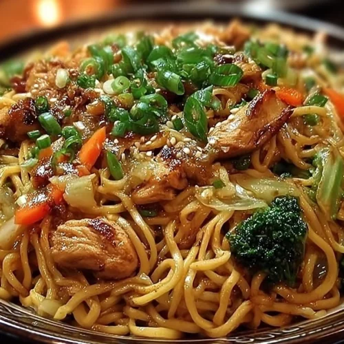 Delicious Garlic Chicken Lo Mein served in a bowl with colorful vegetables.