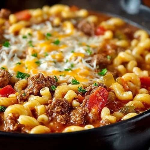 Bowl of traditional old fashioned goulash topped with herbs and spices