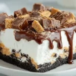 Peanut Butter Cup Icebox Cake topped with chocolate and peanut butter cups
