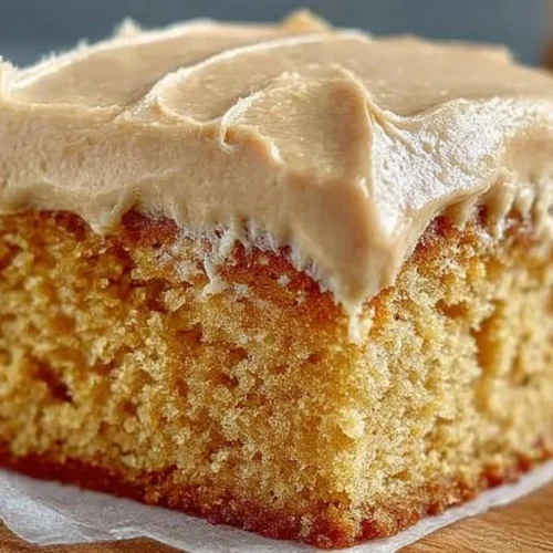 Delicious peanut butter sheet cake topped with creamy frosting