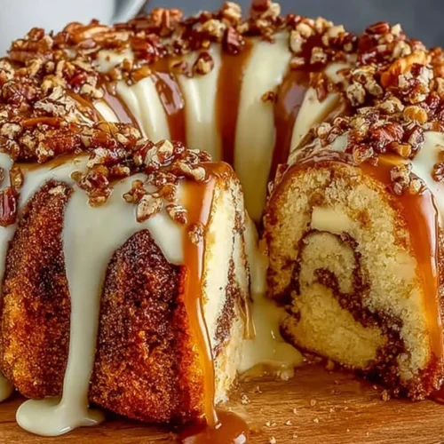 Delicious Pecan Caramel Cinnamon Roll Cream Cheese Pound Cake on a plate