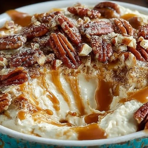 Delicious salted caramel pecan cheesecake dip served in a bowl