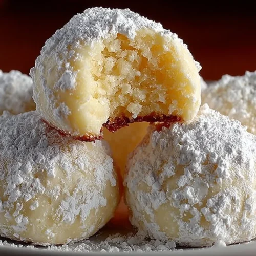 Sweetened condensed milk snowball cookies dusted with powdered sugar