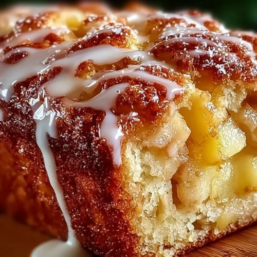 Delicious Amish apple fritter bread with chunks of apple and glaze