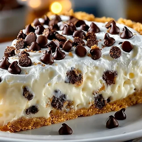 No-bake cannoli cream pie topped with whipped cream and chocolate shavings