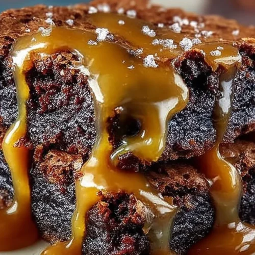 Delicious caramel fudge brownies with a rich chocolate layer and gooey caramel drizzle