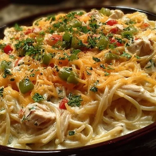 Delicious Chicken Spaghetti dish garnished with herbs and served in a bowl