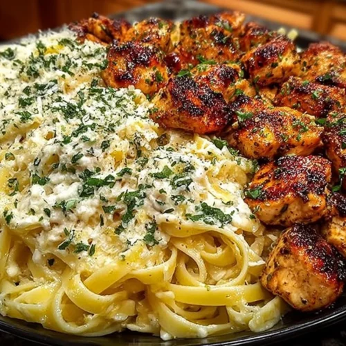 Creamy garlic butter chicken served with linguine in Alfredo sauce