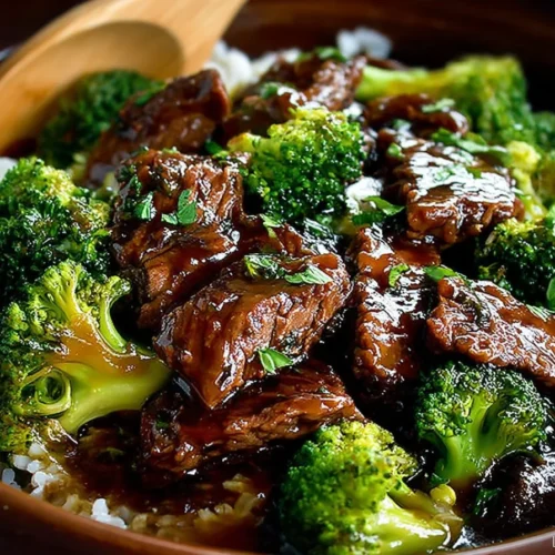 Crock Pot Beef and Broccoli dish served in a bowl with broccoli and tender beef slices.