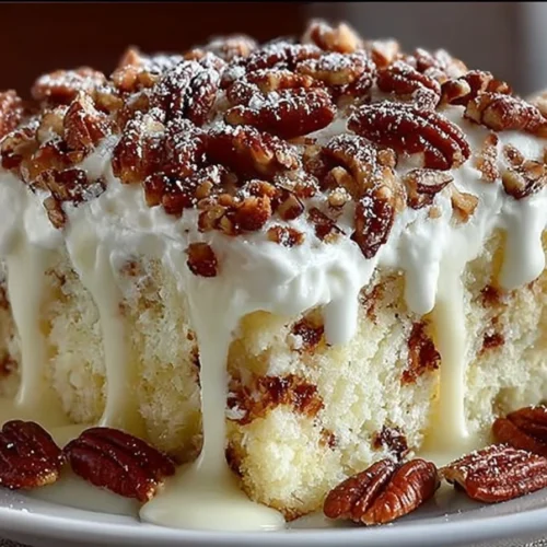Delicious Elvis Presley Cake topped with creamy frosting and pecans.