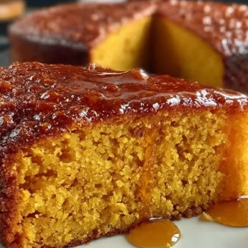 Flourless Sweet Potato Ginger Cake topped with fresh ginger and spices.