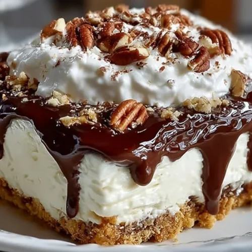 A beautifully presented slice of one of the best desserts ever, topped with fresh berries.