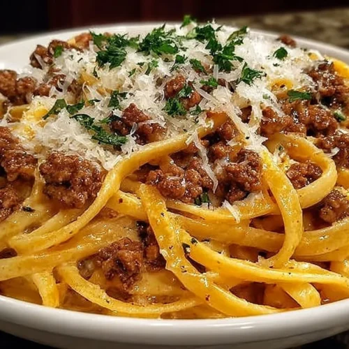 Savory garlic butter linguine with ground beef and creamy parmesan sauce