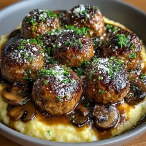Delicious beef meatballs in savory mushroom gravy served on a plate