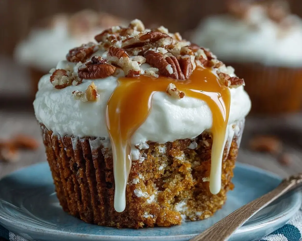 Delicious caramel pecan carrot cupcakes topped with a rich frosting.