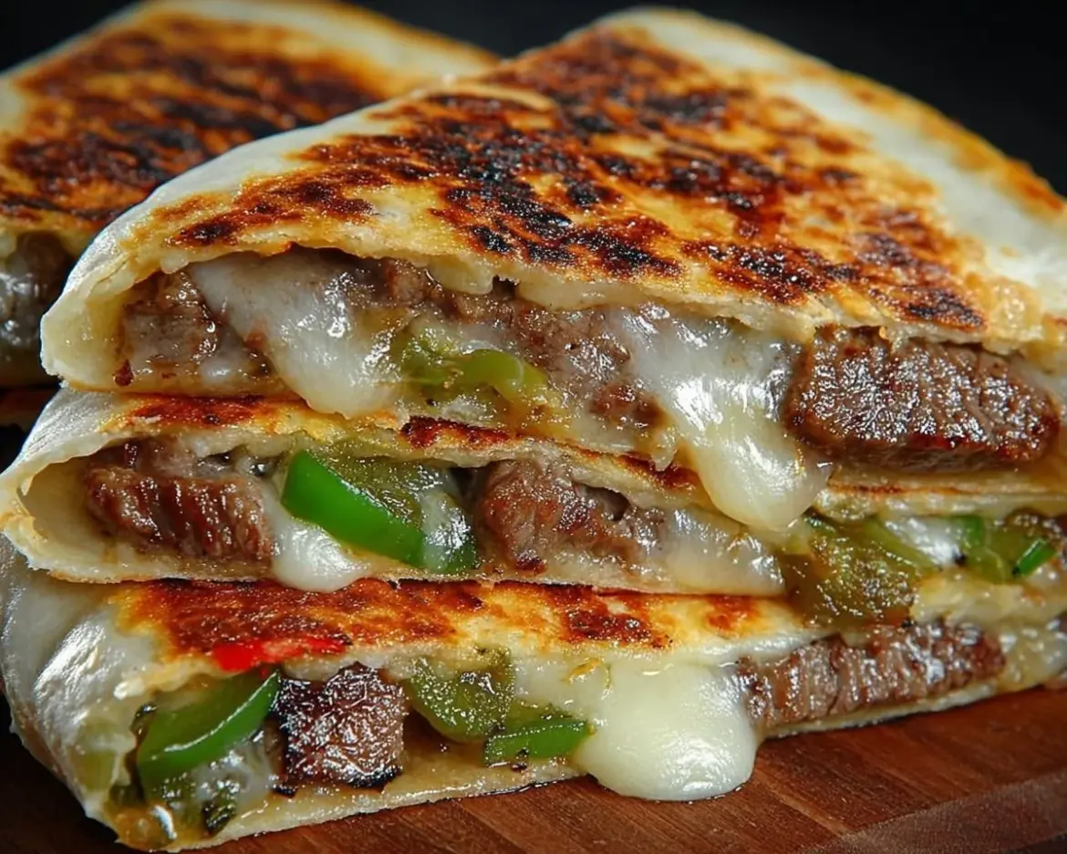 Delicious cheese steak quesadillas filled with cheesy goodness and steak