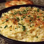 Creamy Garlic Parmesan Orzo dish garnished with parsley and parmesan cheese