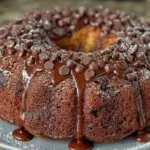 Delicious Death By Chocolate Bundt Cake topped with rich chocolate ganache.