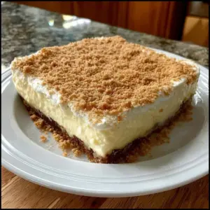 Delicious No-Bake Woolworth Icebox Cheesecake topped with whipped cream and berries