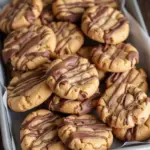 Delicious Snickers Peanut Butter Cookies with chocolate and caramel filling