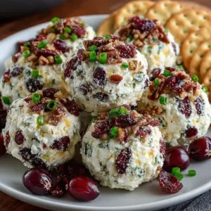 Sweet and nutty Cranberry Pecan Cheese Bites on a serving platter.